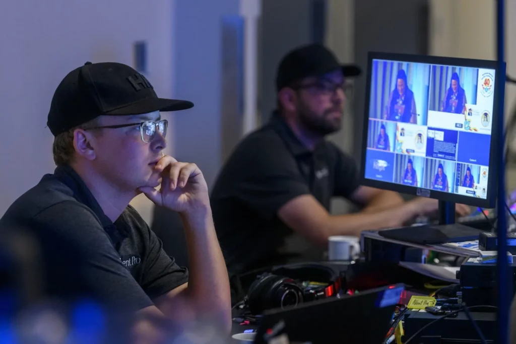 Two AVentPro crew members watching an event feed during an event