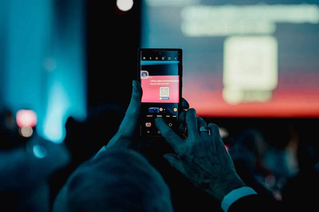 An attendee scanning an interactive QR code